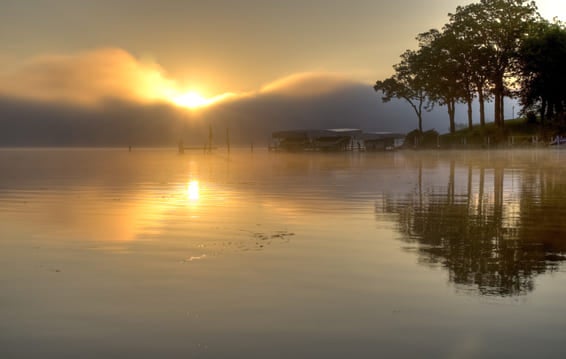 A misty morning on Lake Okoboji at dawn.